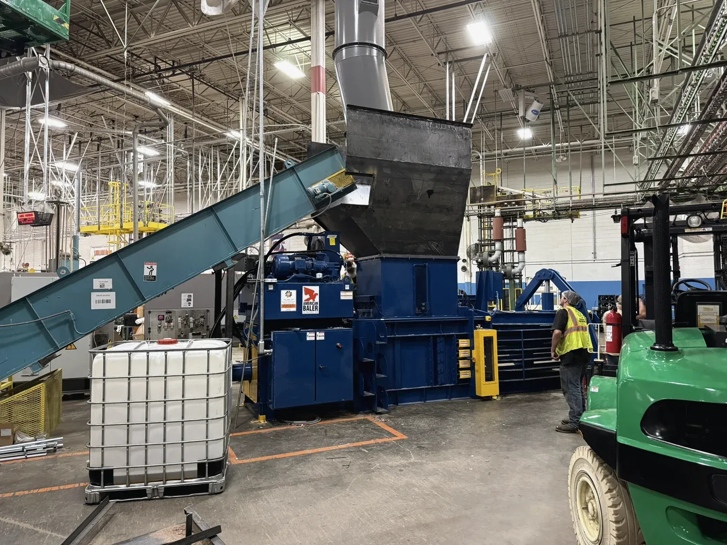 Horizontal baler install with a Norton-fabricated infeed hopper