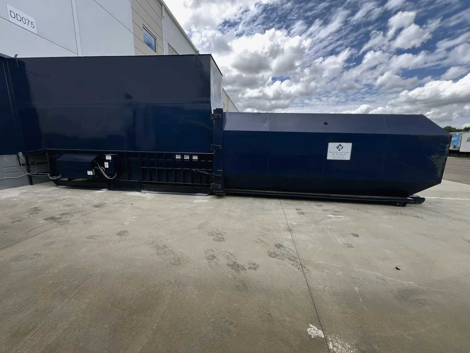 A compactor rebuilt and re-enclosed by the Norton shop