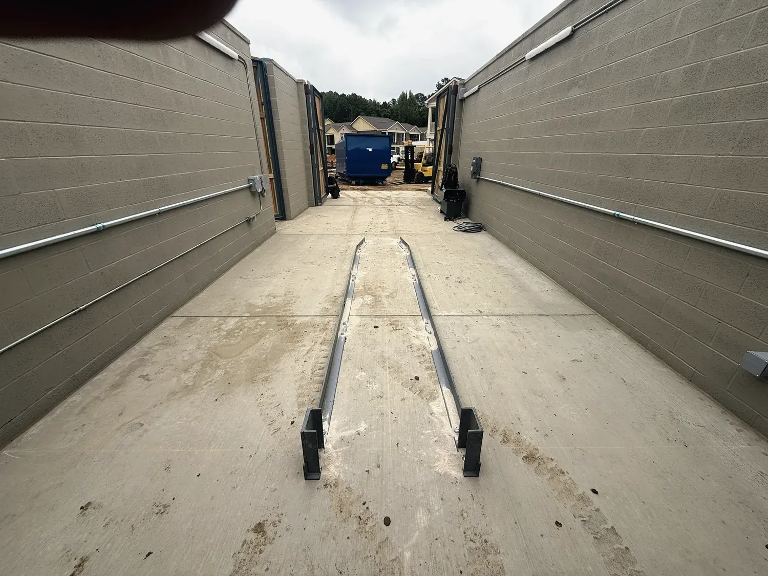 Compactor guide rails set and aligned during a repair