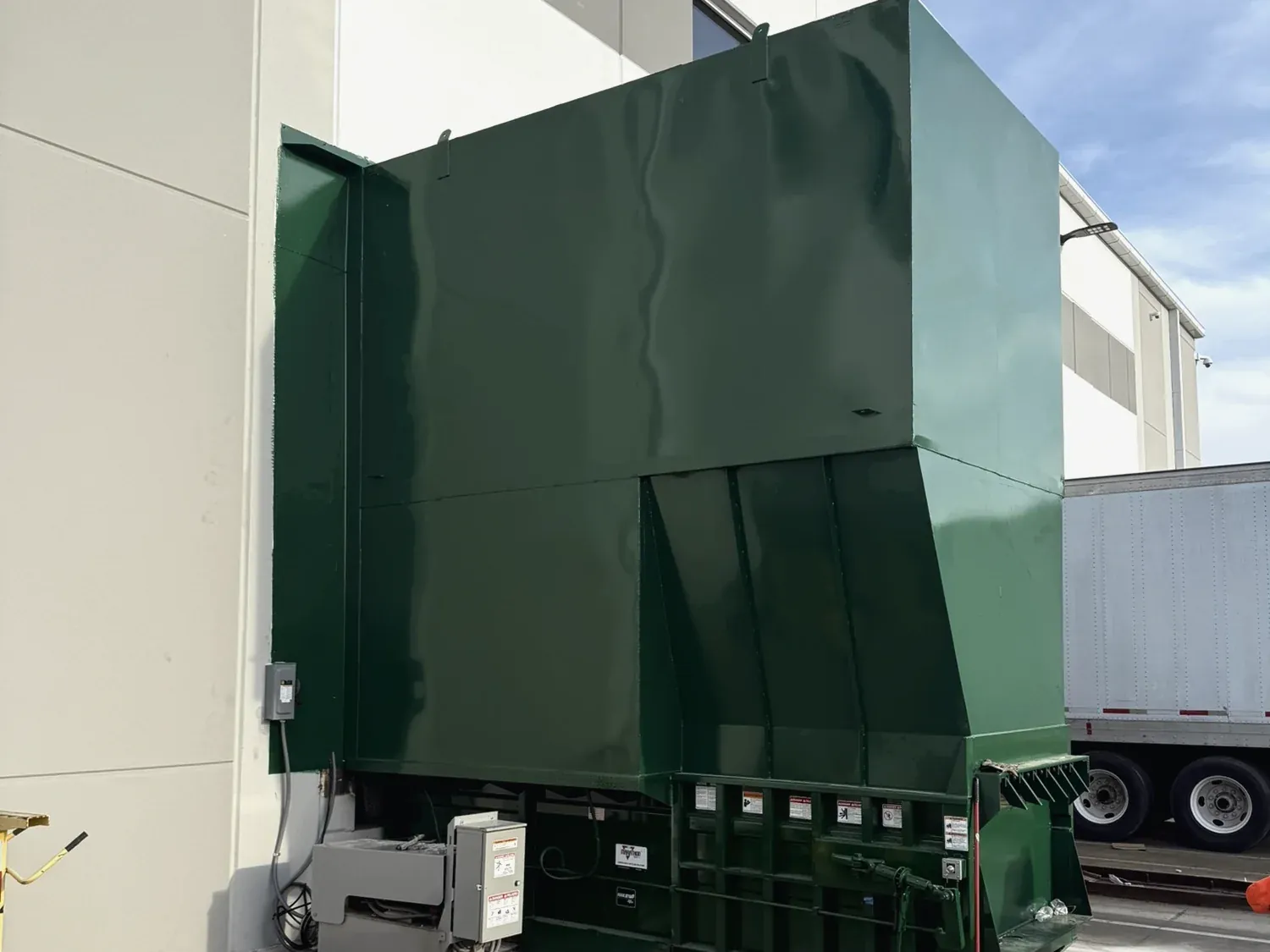 A compactor enclosure fabricated by Norton