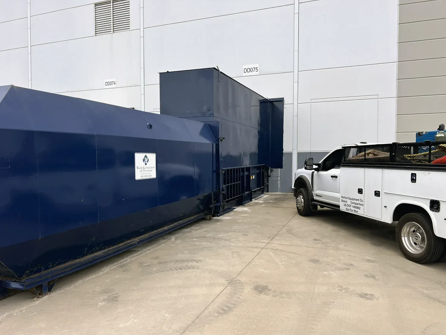 Reconditioned compactor with a Norton service truck on site